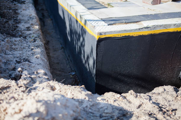 Professional Waterproofing technician working in Selden, NY